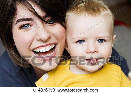 Mother and baby posing together View Large Photo Image Stock Image - Mother and baby posing together. Fotosearch