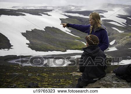 Stock Image - Mother and daughter admiring landscape. Fotosearch