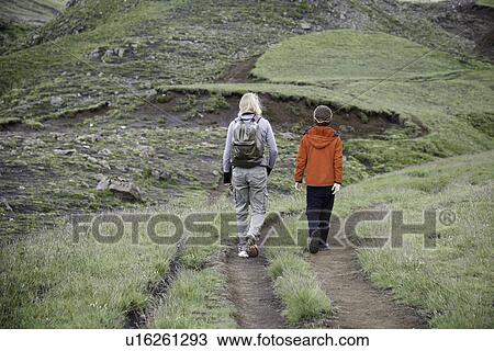 Mother and daughter hiking on hillside View Large Photo Image Stock Image - Mother and daughter hiking on hillside. Fotosearch