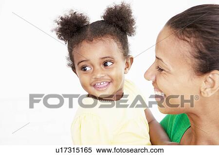 Mother and daughter laughing in kitchen View Large Photo Image Stock Photography - Mother and daughter laughing in kitchen. Fotosearch