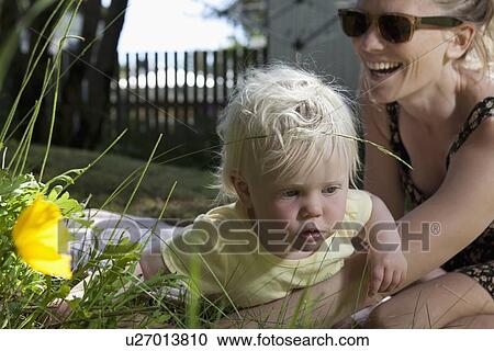Mother and daughter playing outdoors View Large Photo Image Stock Image - Mother and daughter playing outdoors. Fotosearch