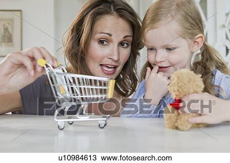 Mother and daughter playing with toys View Large Photo Image Stock Image - Mother and daughter playing with toys. Fotosearch