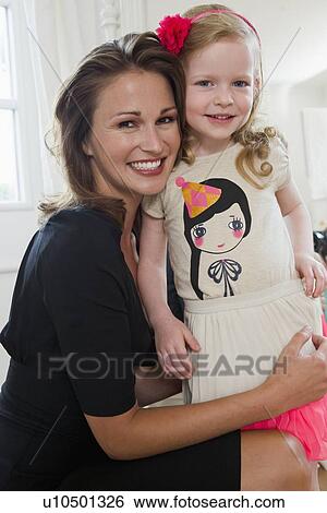 Mother and daughter smiling together View Large Photo Image Stock Photograph - Mother and daughter smiling together. Fotosearch