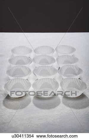 Neatly arranged cupcake wrappers View Large Photo Image Picture - Neatly arranged cupcake wrappers. Fotosearch