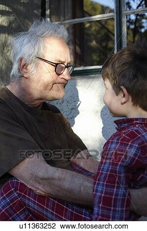 Older man with grandson outdoors View Large Photo Image Stock Image - Older man with grandson outdoors. Fotosearch