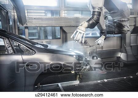 Paint spraying robots in car factory View Large Photo Image Stock Image - Paint spraying robots in car factory. Fotosearch