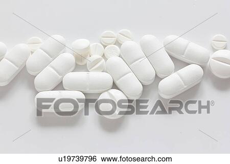 Pile of pills on counter View Large Photo Image Stock Photograph - Pile of pills on counter. Fotosearch
