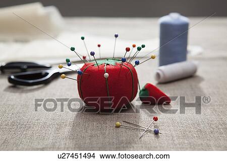 Pin cushion, thread and scissors View Large Photo Image Picture - Pin cushion, thread and scissors. Fotosearch