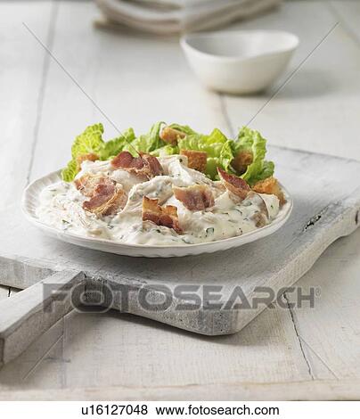 Stock Photo - Plate of chicken bacon caesar salad. Fotosearch