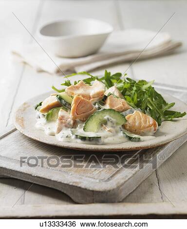 Stock Photograph - Plate of poached salmon with salad. Fotosearch