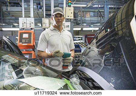 Portrait of car assembly worker in car factory View Large Photo Image Picture - Portrait of car assembly worker in car factory. Fotosearch