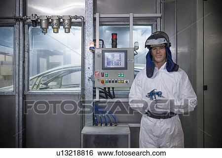 Portrait of paint sprayer in car factory View Large Photo Image Stock Photograph - Portrait of paint sprayer in car factory. Fotosearch
