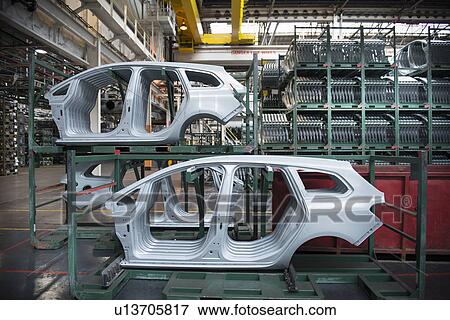 Pressed car parts in car factory View Large Photo Image Stock Photo - Pressed car parts in car factory. Fotosearch