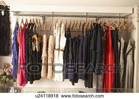 Stock Photo - Rack of dresses for sale in store. Fotosearch
