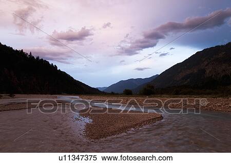 Stock Photography - River running through mountain valley. Fotosearch