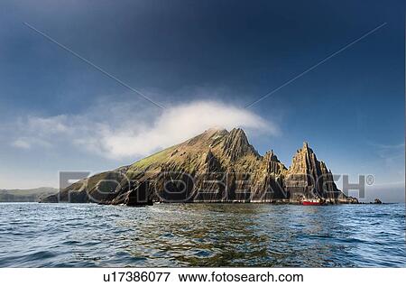 Stock Photo - Rock formations in still water. Fotosearch