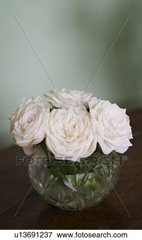 Roses in glass on table View Large Photo Image Stock Photo - Roses in glass on table. Fotosearch