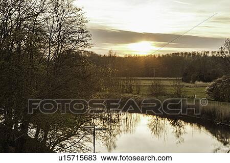 Rural landscape reflected in river View Large Photo Image Stock Image - Rural landscape reflected in river. Fotosearch