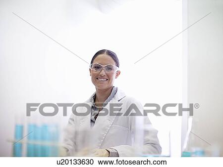 Scientist smiling in lab View Large Photo Image Stock Image - Scientist smiling in lab. Fotosearch