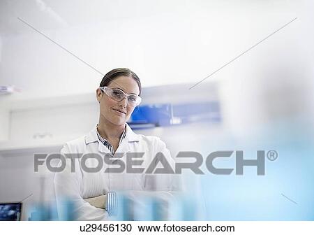 Scientist smiling in lab View Large Photo Image Stock Image - Scientist smiling in lab. Fotosearch