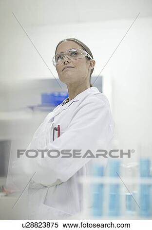 Stock Photography - Scientist standing in lab. Fotosearch