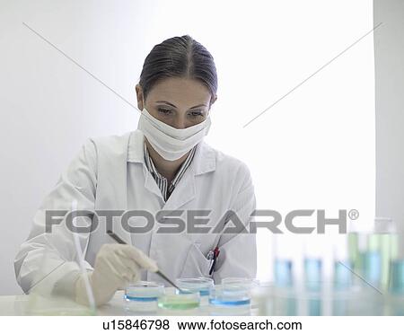 Stock Photo - Scientist working in lab. Fotosearch