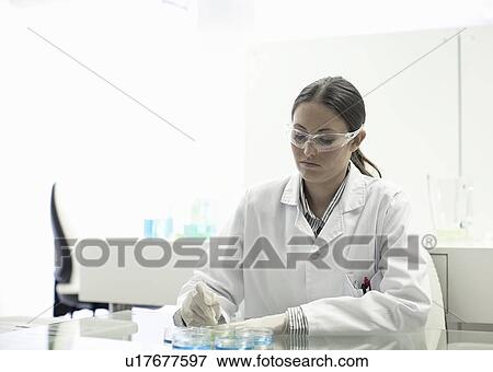 Stock Photo - Scientist working in lab. Fotosearch
