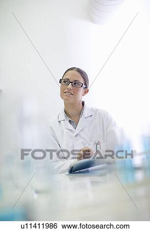 Scientist working in lab View Large Photo Image Stock Photograph - Scientist working in lab. Fotosearch