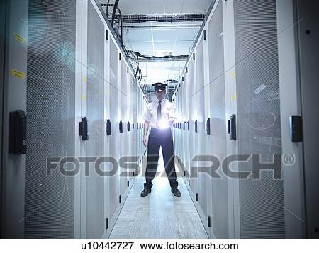 Security guard in server room View Large Photo Image Stock Photo - Security guard in server room. Fotosearch
