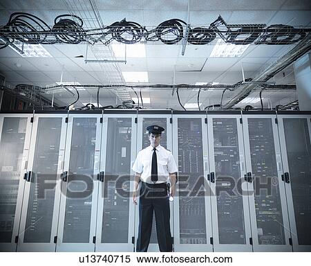 Security guard standing in server room View Large Photo Image Stock Photography - Security guard standing in server room. Fotosearch