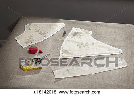Sewing pattern, pin cushion and tape View Large Photo Image Stock Photo - Sewing pattern, pin cushion and tape. Fotosearch