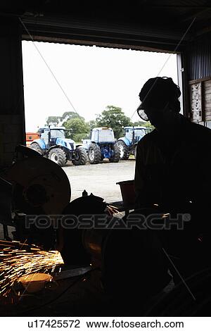 Silhouette of metal worker in shop View Large Photo Image Stock Image - Silhouette of metal worker in shop. Fotosearch