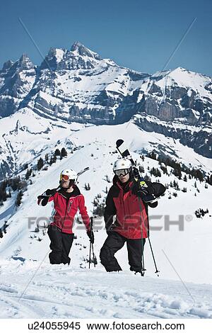 Skiers climbing snowy mountainside View Large Photo Image Stock Photography - Skiers climbing snowy mountainside. Fotosearch