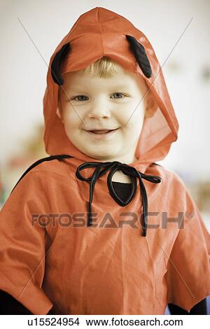 Picture - Smiling boy wearing devil costume. Fotosearch