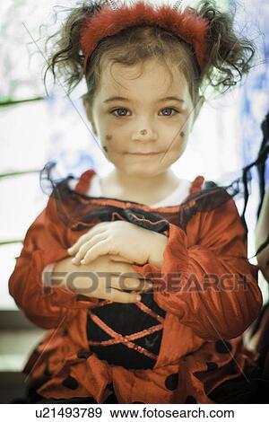 Stock Photo - Smiling girl wearing fairy costume. Fotosearch