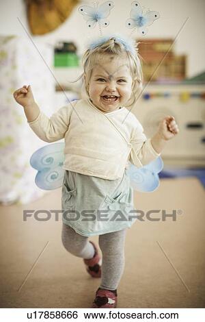 Stock Photograph - Smiling girl wearing fairy costume. Fotosearch