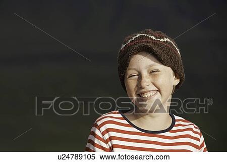 Smiling girl wearing knitted cap View Large Photo Image Stock Photography - Smiling girl wearing knitted cap. Fotosearch