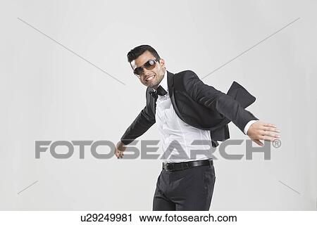Smiling man in tuxedo dancing View Large Photo Image Stock Image - Smiling man in tuxedo dancing. Fotosearch