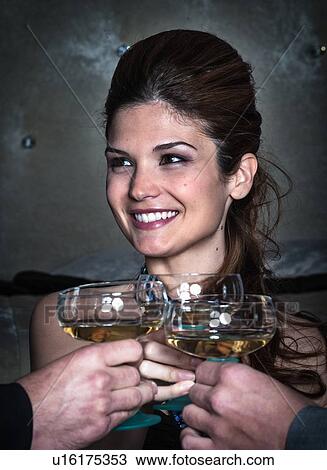 Smiling woman toasting with friends View Large Photo Image Stock Image - Smiling woman toasting with friends. Fotosearch