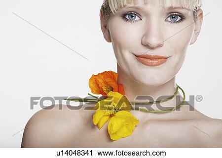 Smiling woman wearing flower necklace View Large Photo Image Stock Image - Smiling woman wearing flower necklace. Fotosearch