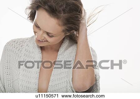 Stock Image - Smiling woman wearing robe. Fotosearch