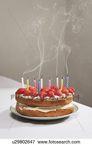 Smoking candles on birthday cake View Large Photo Image Stock Photo - Smoking candles on birthday cake. Fotosearch