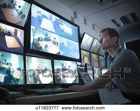 Stock Photo - Student working in forensic screen room. Fotosearch