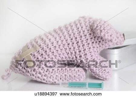 Stock Photo - Stuffed animal with bandage on back. Fotosearch