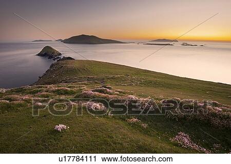 Stock Image - Sun setting over rural skyline. Fotosearch