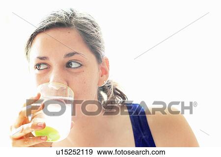 Stock Photo - Teenage girl drinking water. Fotosearch