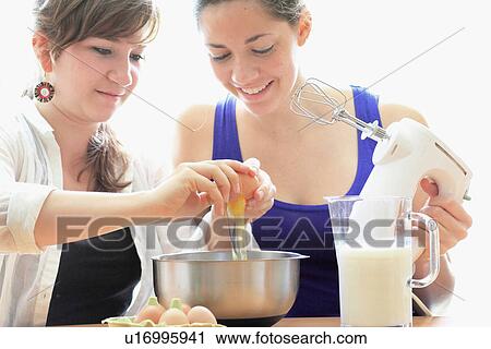 Teenage girls cooking together View Large Photo Image Stock Image - Teenage girls cooking together. Fotosearch
