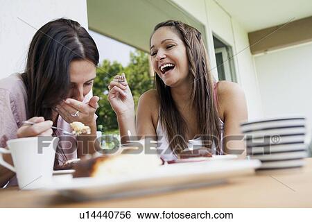 Teenage girls laughing at lunch View Large Photo Image Stock Photograph - Teenage girls laughing at lunch. Fotosearch
