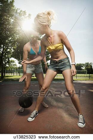 Teenage girls playing basketball View Large Photo Image Stock Image - Teenage girls playing basketball. Fotosearch