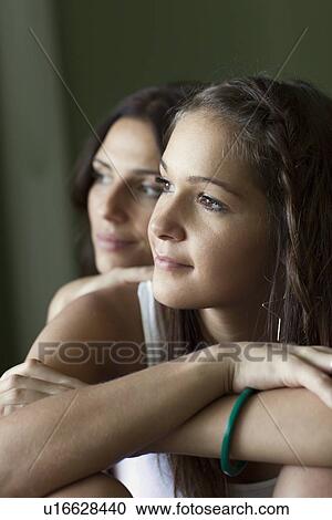 Stock Image - Teenage girls sitting together. Fotosearch